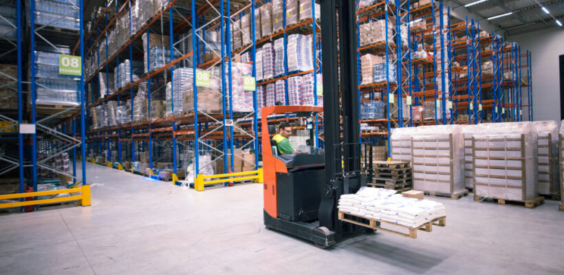 worker-operating-forklift-machine-relocating-goods-large-warehouse-center (1)